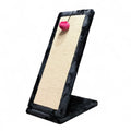 Maroc-animalerie black plush cat scratching post with sisal surface and pink pom-pom toy.