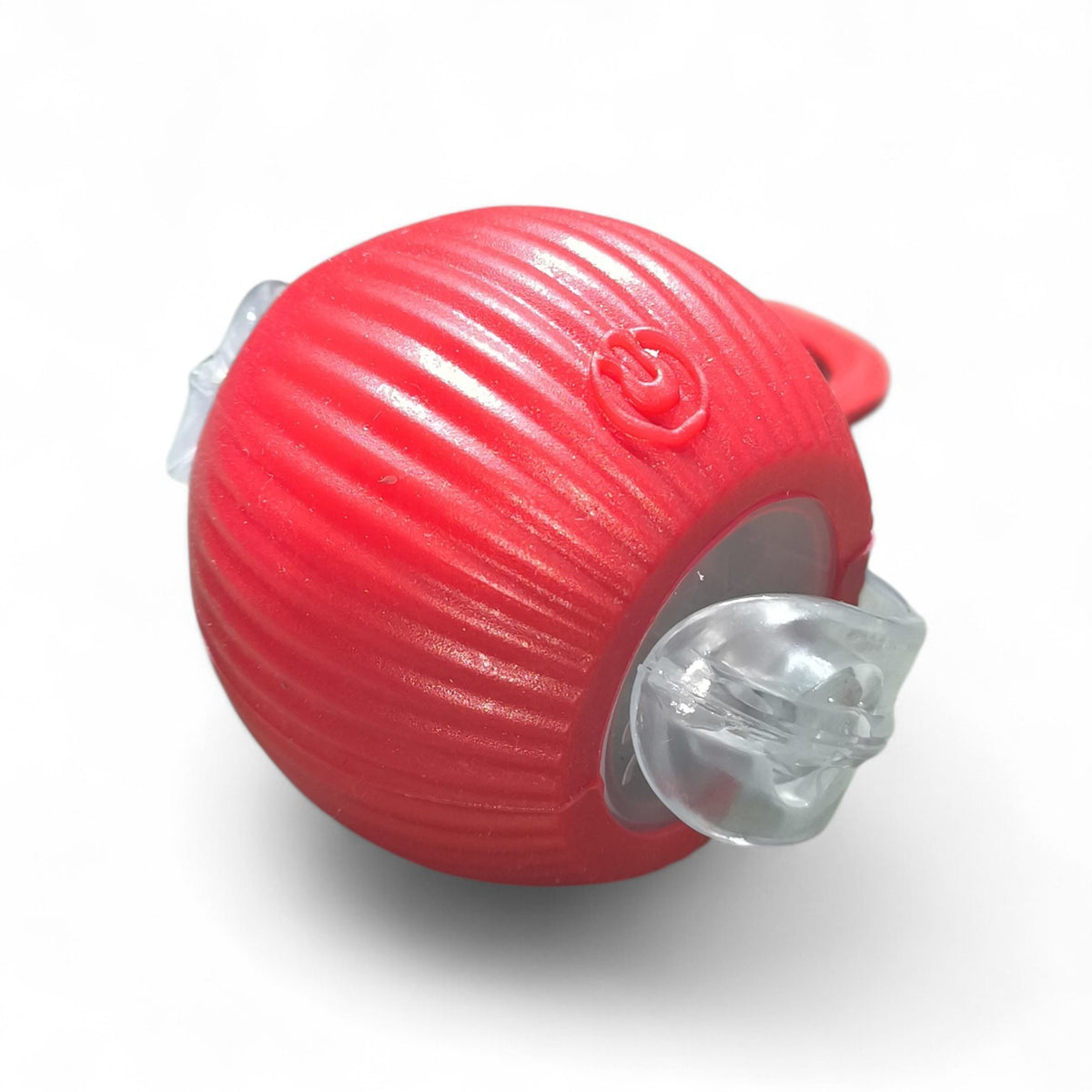 Maroc-animalerie red textured plastic interactive pet treat dispensing ball toy with clear gripping elements and red cord.