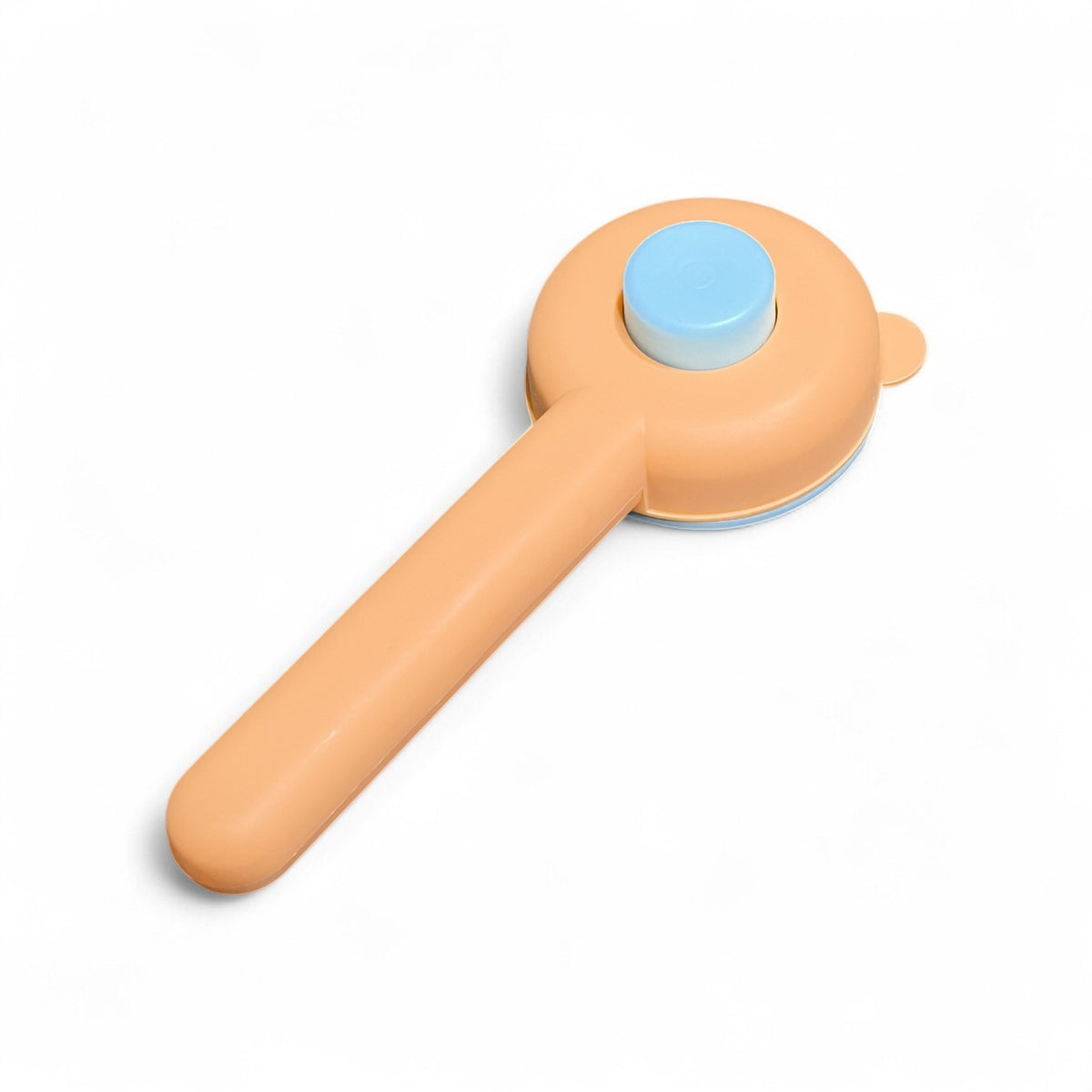 Maroc-animalerie self-cleaning pet grooming brush with orange handle and blue button for easy fur removal.