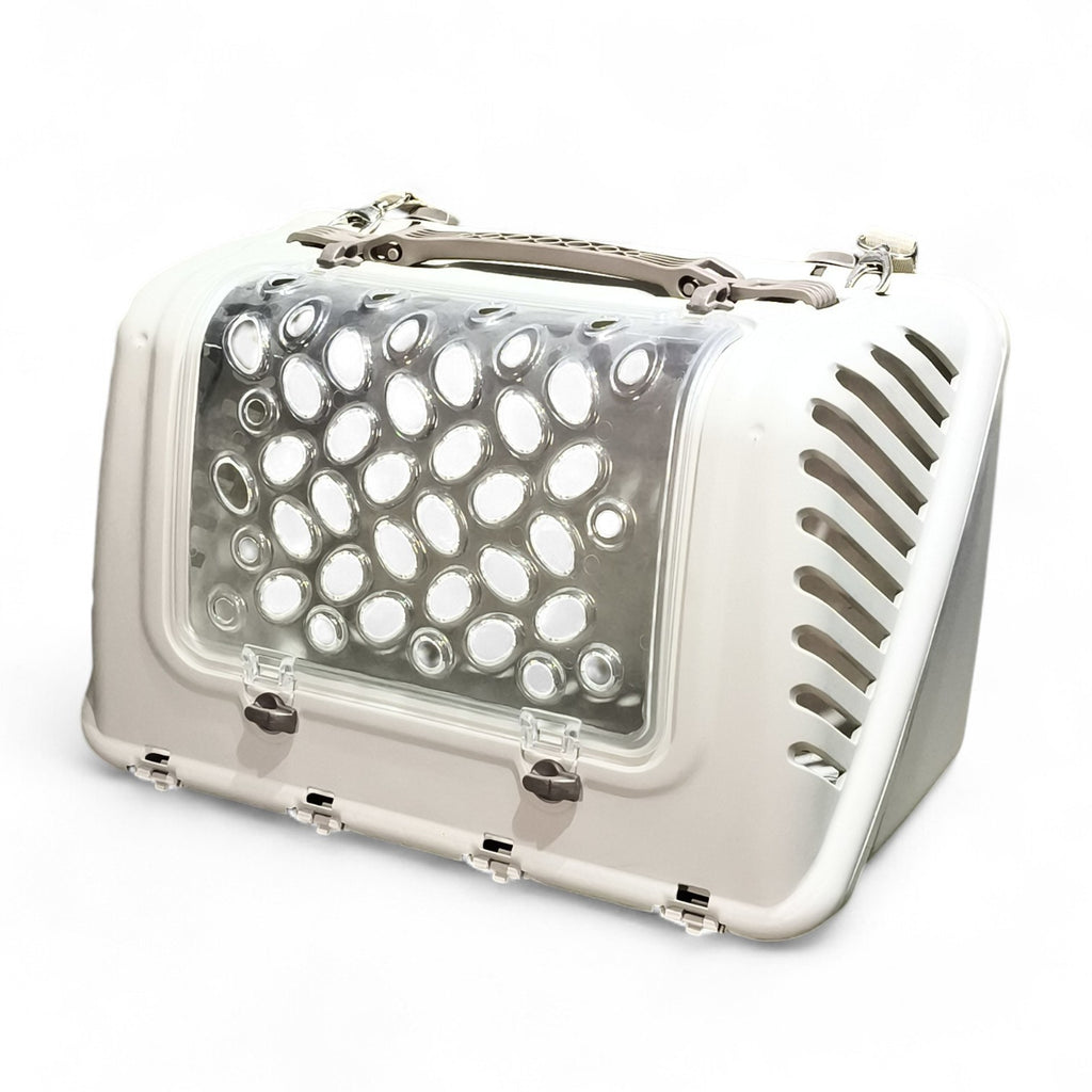 Maroc-Animalerie white plastic pet carrier with clear perforated top for ventilation and visibility. Features secure latches and a robust handle.