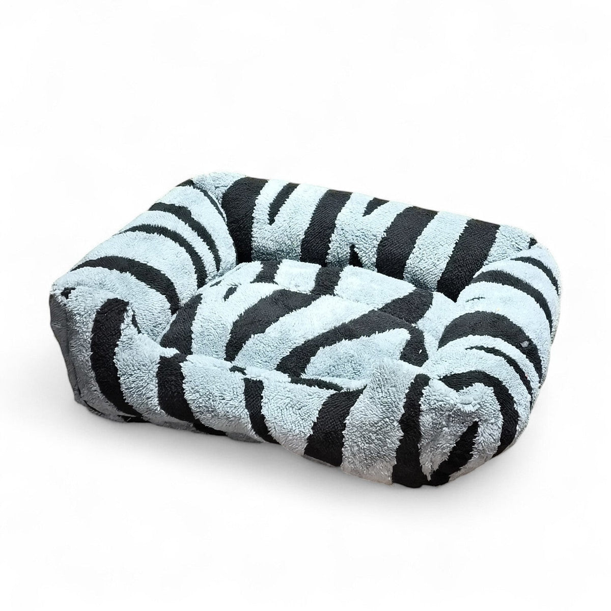 Maroc-animalerie plush pet bed with black and light blue zebra print. Soft, cozy material with raised sides.