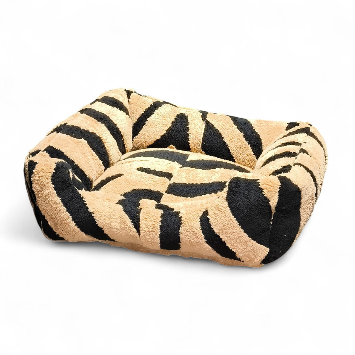Maroc-animalerie plush pet bed with black and tan zebra print. Cozy, durable, and comfortable for small to medium pets.